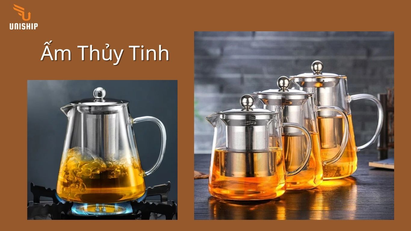 Dưới đây là mô tả nội dung hình ảnh trong đúng 20 từ:Ấm thủy tinh trong suốt hiện đại, phô diễn trọn vẹn màu sắc nước trà và vẻ đẹp của những đóa hoa đang nở rộ.